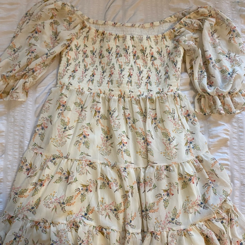 Beige flowery dress with colorful followers. Very flattering